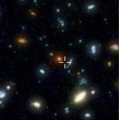 In diesem Ausschnitt aus dem Hubble Deep Field befindet sich HDF850.1. Das Kreuz zeigt den Ort der Submillimeter-Galaxie an – im herkömmlichen, sichtbaren Licht ist die Galaxie unsichtbar.
Quelle: Bild: STScI / NASA, F. Walter (MPIA) (idw)