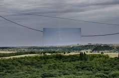 Bitte das Foto vergrößern, um die  Rauchsäule in der Mitte des Fotos zu  sehen. Sie soll den Kondensstreifen der  abgeschossenen BUK-Rakete darstellen.  Aufgenommen in Thorez, 20 km entfernt  von Snizhne.