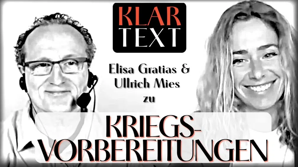 Bild: SS Video: "MANOVA: Klartext zu Kriegsvorbereitungen Teil 2/2 (Ullrich Mies und Elisa Gratias)" (https://odysee.com/@Manova_Magazin:3/%2B%2BKT3_Odysee:3) / Eigenes Werk