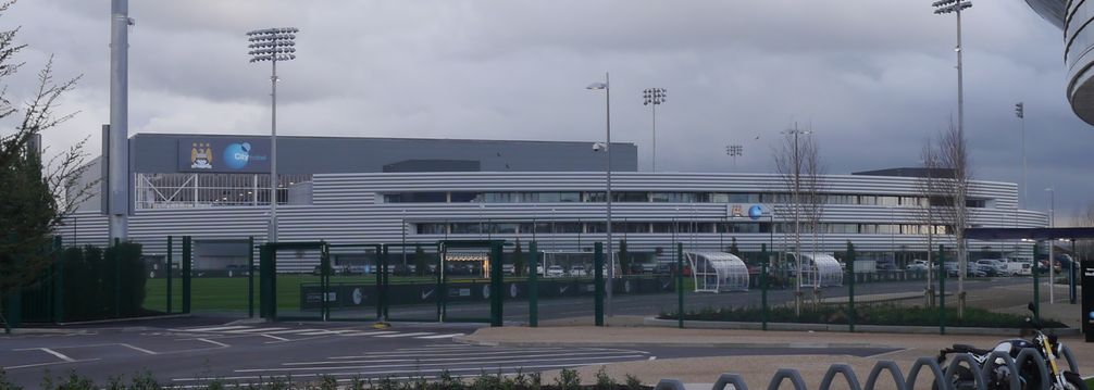 Manchester City moved into their new complex at the Etihad Campus adjacent to the City of Manchester Stadium in 2014.