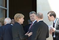 Angela Merkel, Petro Poroschenko und Wladimir Putin am 6. Juni 2014