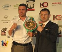 Vitali Klitschko and Adamek, during signing for the fight in 2011