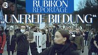 Bild: SS Video: "RUBIKON: Reportage: „Unfreie Bildung“ (Nicolas Riedl und Flavio von Witzleben)" (https://odysee.com/Unfreie-Bildung:440530a0d84e65d020ff1f6e3c3e88382af44a46?src=embed) / Eigenes WErk