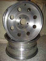 Forged aluminum wheels. Made by Alcoa with their typical design.