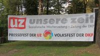 Ein Transparent auf dem UZ-Pressefest im Revierpark Dortmund 2018