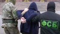 FSB-Mitarbeiter bei der Festnahme eines der Mitglieder der Neonazi-Gruppe in der russischen Teilrepublik Baschkirien