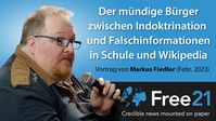 Bild: SS Video: "Indoktrination und Falschinformationen in Schule und Wikipedia - Vortrag Markus Fiedler - Free21.org" (https://youtu.be/zYh86aRRmFw) / Eigenes Werk