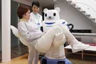 Patientin heben: So schont "ROBEAR" den Pfleger-Rücken. Bild: riken.jp/en