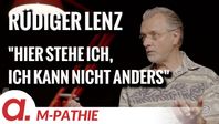 Bild: SS Video: "M-PATHIE SPEZIAL – Ali Wagner interviewt Rüdiger Lenz – “Hier stehe ich, ich kann nicht anders”" (https://tube4.apolut.net/w/mV6nhQNGhDba3pZGDS2skJ) / Eigenes Werk